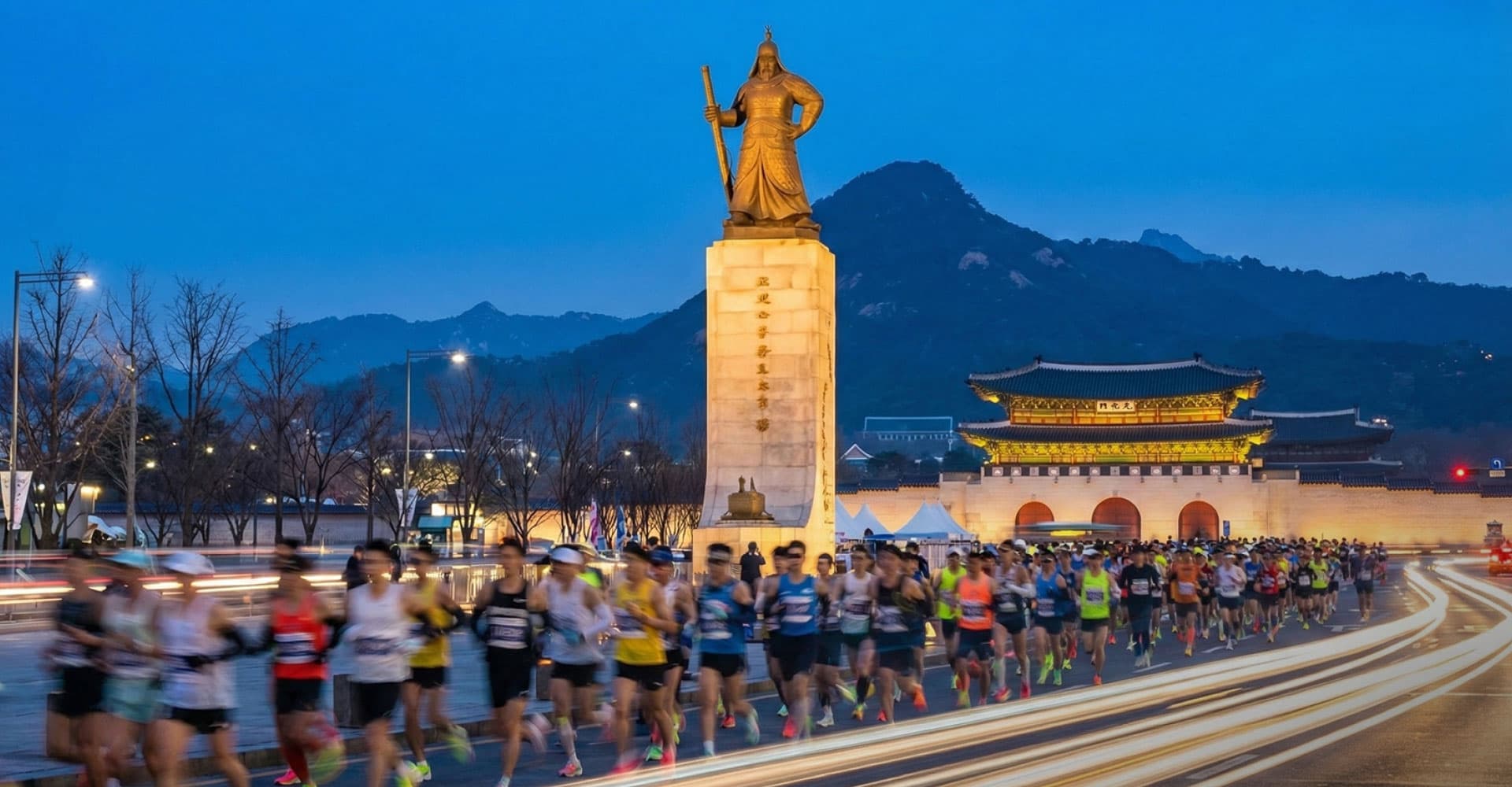 Runners passing the Admiral Yi Sun-sin statue at Gwanghwamun Square during the Seoul Marathon